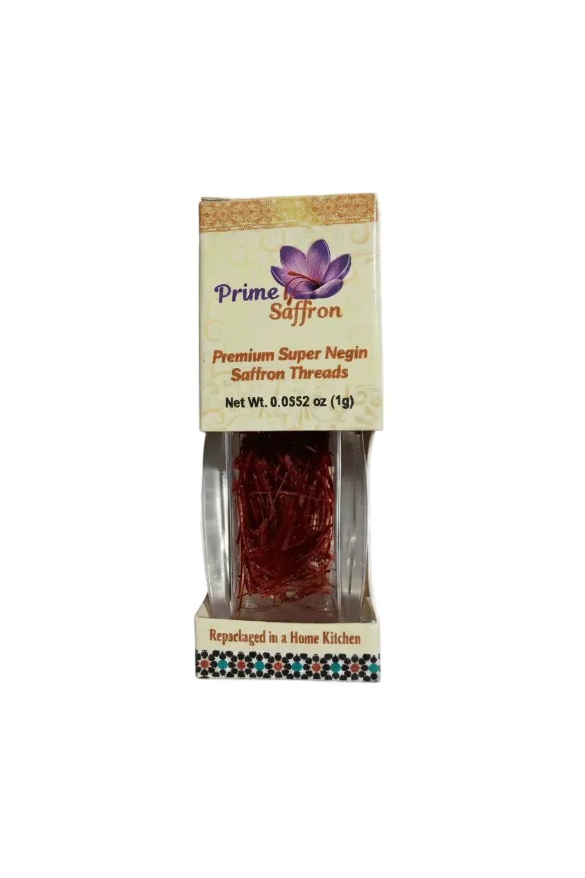 Prime Saffron Premium Super Negin Saffron Threads in a clear plastic package with a decorative beige label and a small floral border at the bottom.